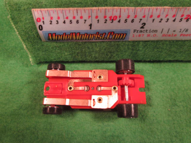 Bottom view of Dash IROC Corrected Red HO Slot Car Chassis