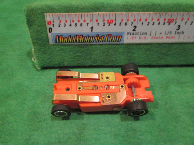 Bottom view of Dash IROC Error Red HO Slot Car Chassis
