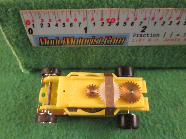 Top view of Dash Mondo Grip IROC Yellow HO Slot Car Chassis