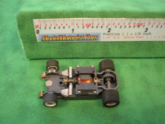 Top view of Aurora AFX G-Plus Narrow Fixed Axle Slot Car Chassis