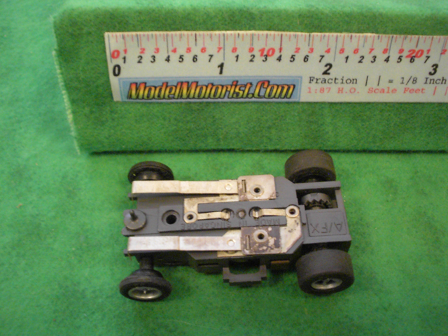 Bottom view of Aurora AFX Slot Car Chassis (pre Magna-Traction)