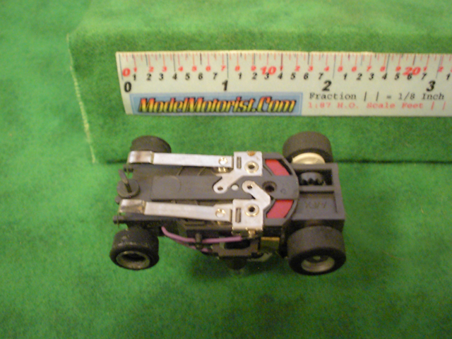 Bottom view of Aurora AFX Stop Police Slot Car Chassis