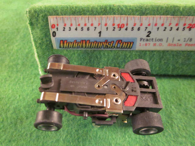 Bottom view of Aurora AFX Stop Police Slot Car Chassis