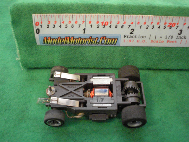Bottom view of Aurora AFX Cat's Eyes Slot Car Chassis