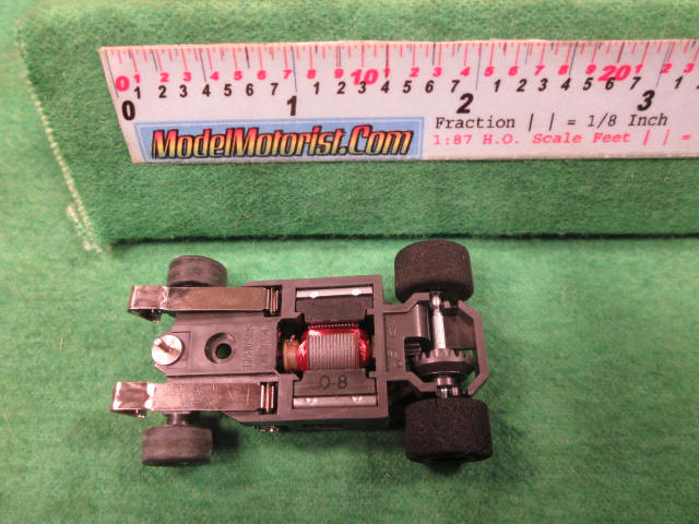 Bottom view of Aurora AFX G-Plus Narrow Snap-In Axle Slot Car Chassis