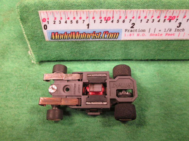 Bottom view of Aurora AFX G-Plus Wide Fixed Axle Slot Car Chassis