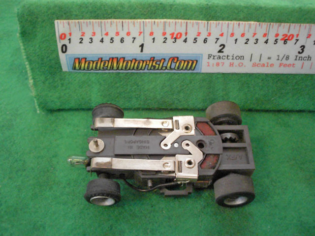 Bottom view of Aurora AFX Magna-Traction Lighted Slot Car Chassis