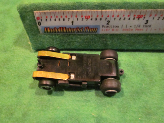 Bottom view of Ideal Lighted Bi-Directional HO Slot Car Chassis