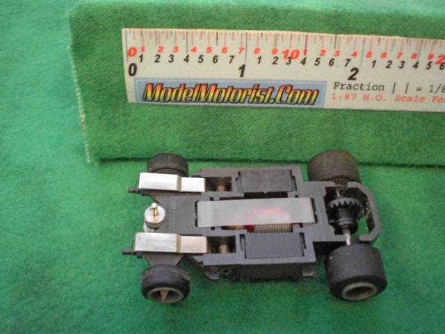 Bottom view of Life-Like Lighted M-Car HO Slot Car Chassis