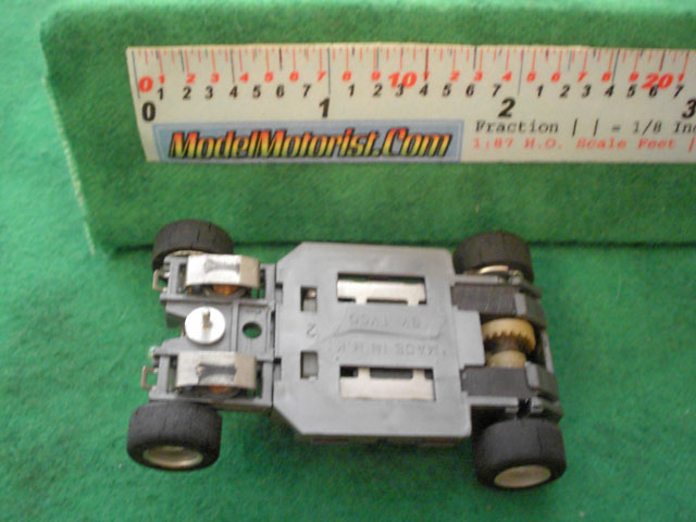 Bottom view of Tyco HP-2 Lighted Curve Hugger HO Slot Car Chassis