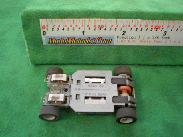 Bottom view of Tyco HP-2 Curve Hugger HO Slot Car Chassis