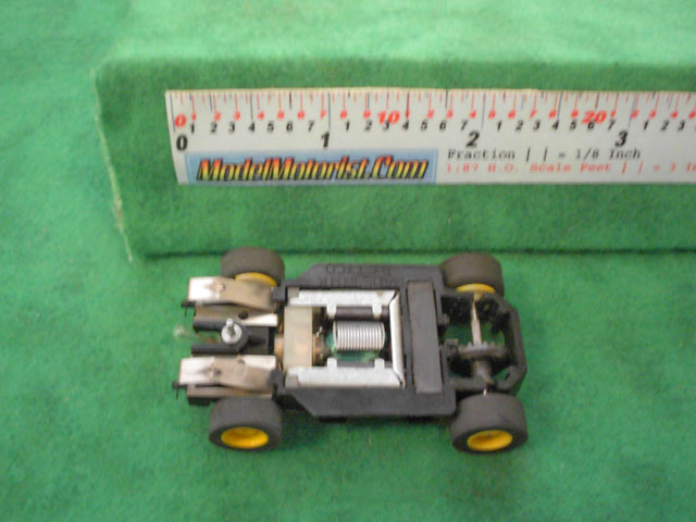 Bottom view of Tyco Lighted HP-7 HO Slot Car Chassis