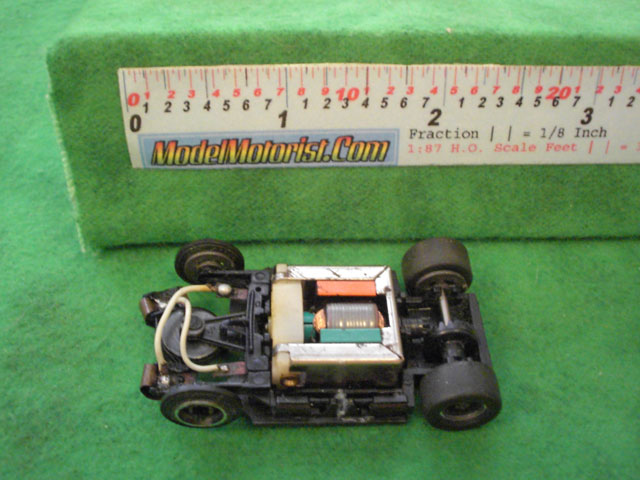 Top view of Tyco TycoPro Lighted with Dropdown Arm HO Slot Car Chassis